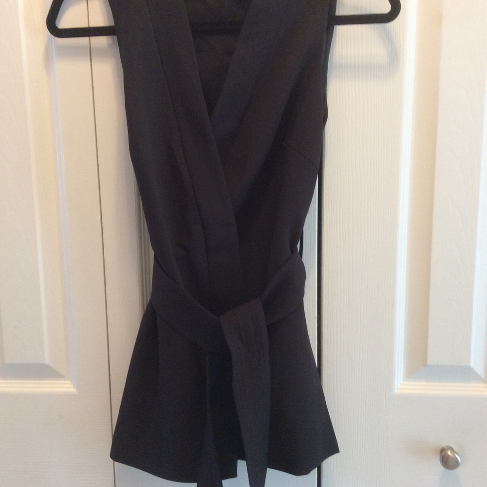 Intermix sleeveless belted wrap top